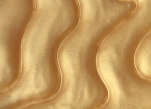 Dune back-painted with rich metallic gold