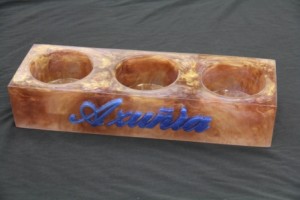 Triple bottle base in resin with Azunia branding